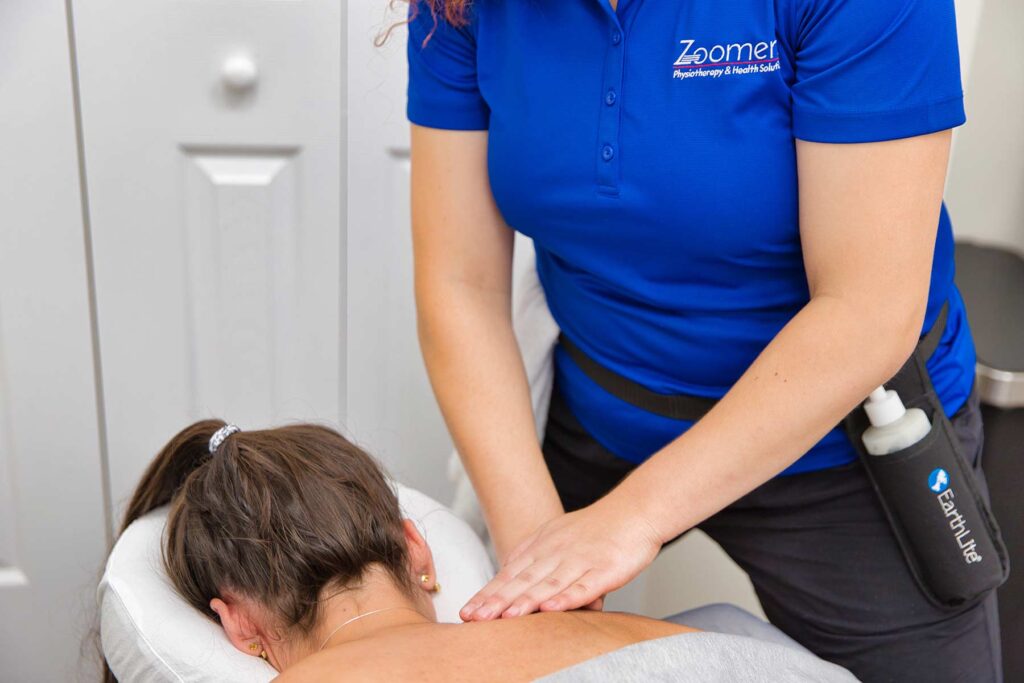 Massage therapist with patient