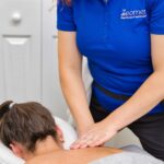 Massage therapist with patient